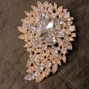 Statement gold tone crystal brooch